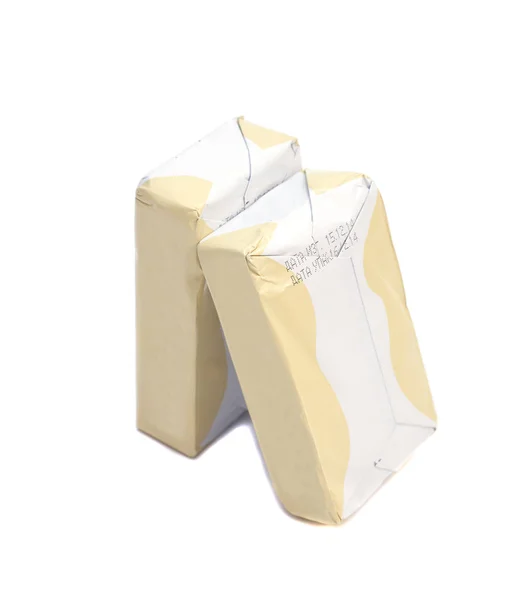 Kije zapakowane masło na białym tle — Zdjęcie stockowe