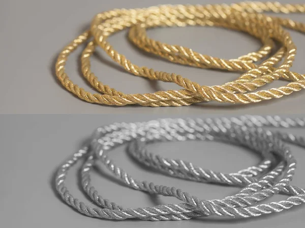 Golden end corda de prata no fundo cinza — Fotografia de Stock
