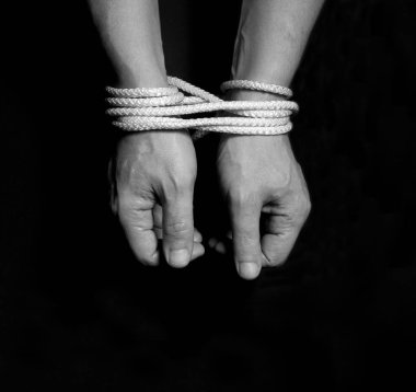 Male hands bound with rope.addiction concept. clipart
