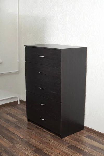 Wood furniture. Wooden dresser in room.