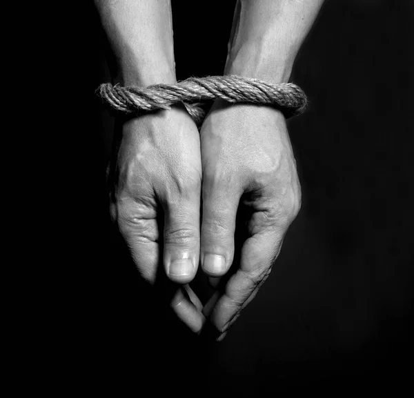 Male hands bound with rope. Addiction concept. — Stock Photo, Image