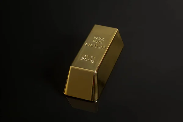 Gold bullion on black background — Stock Photo, Image