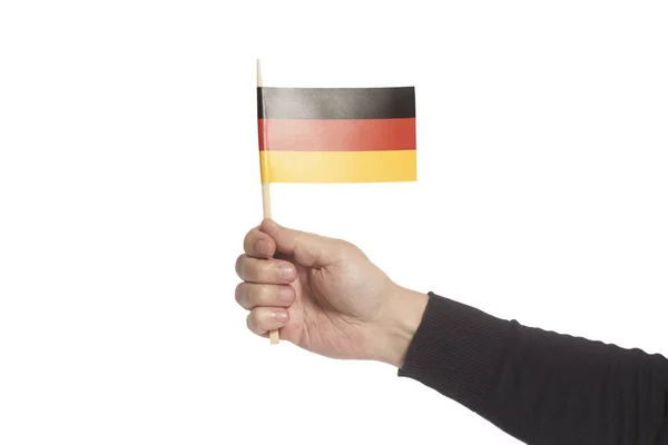Mano sosteniendo bandera de Alemania —  Fotos de Stock