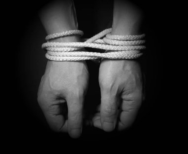 Male hands bound with rope.Addiction concept. clipart