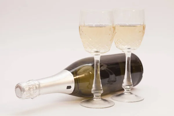 Champagne bottle and champagne glasses — Stock Photo, Image