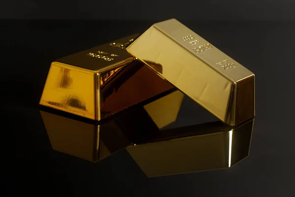 Gold bullion on black background — Stock Photo, Image