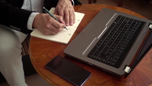 Expert Businessman Working Home Sitting Front His Laptop Taking Notes — Stock Video