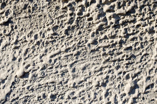 Fondo de piedra gris con una estructura sobresaliente — Foto de Stock