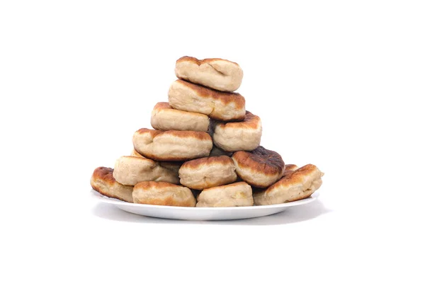 Gebakken taarten met aardappelen op een witte achtergrond — Stockfoto