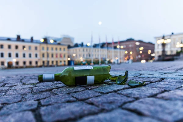 Broken bottle on the street in Helsinki, Finland