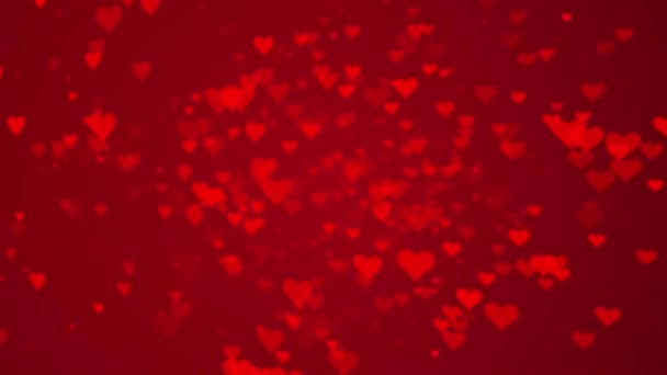 Coeur d'amour tournant, montant, tournant Particules chatoyantes sur fond rouge foncé — Video