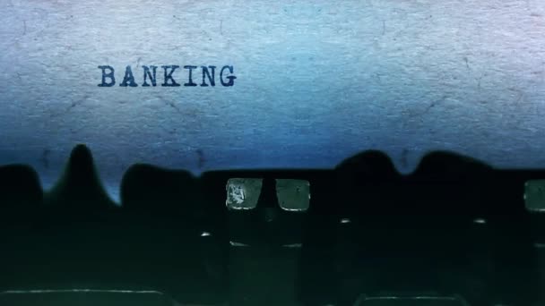 Banking Services words Typing on a sheet of paper with an old vintage typewriter. — Stock Video