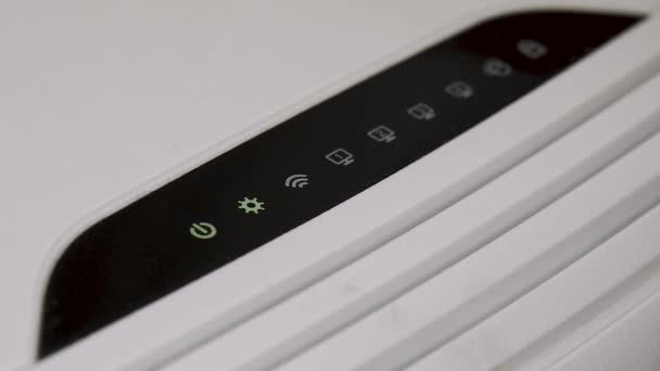 Lights blink on a internet router box in an office — Stock Video