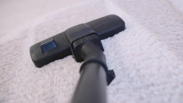 POV of a vacuum cleaner moves on the floor of a bedroom path closeup — Stock Video
