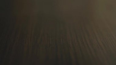 Many yellow medical pills capsules and drugs fall on table close-up