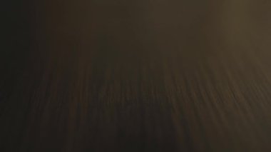 Shot of white pills falling on the table, close up pharmaceutical capsules