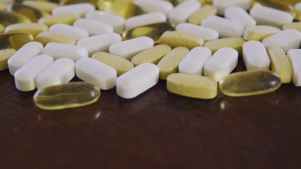 Various pills and tablets, close up dolly shot with selective focus — Stock Video