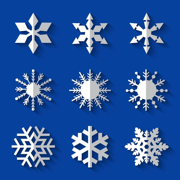 Набір білих сніжинок плоскі значки з довгими тінями на блакитному фоні — стоковий вектор