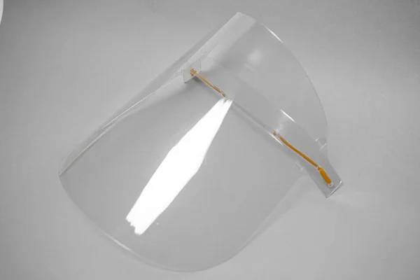 Plexiglass face shield with adjustable mounts, to protect against viruses, covid-19 virus to prevent any objects from getting into your eyes and face, close-up of elements