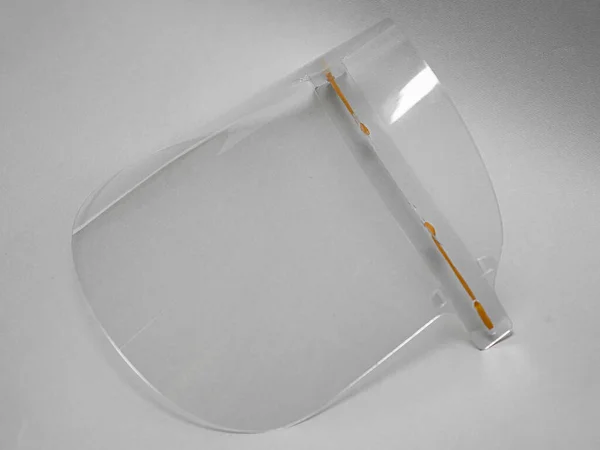 Plexiglass face shield with adjustable mounts, to protect against viruses, covid-19 virus to prevent any objects from getting into your eyes and face, close-up of elements