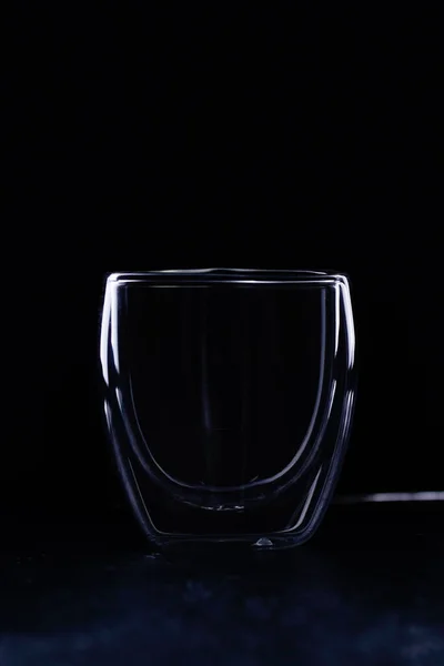 double glass espresso cups on black background