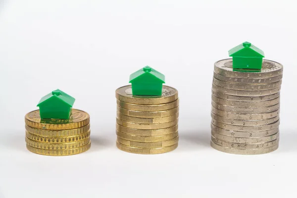 Euro coins and houses — Stock Photo, Image