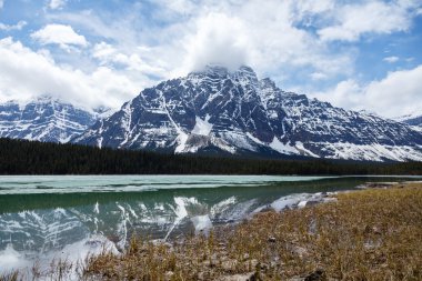 mountain at upperlake Canadian Rockies clipart