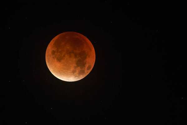 Bloody moon on dark sky 