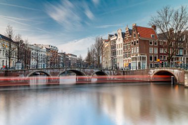 cityscape of the famous canals of Amsterdam clipart