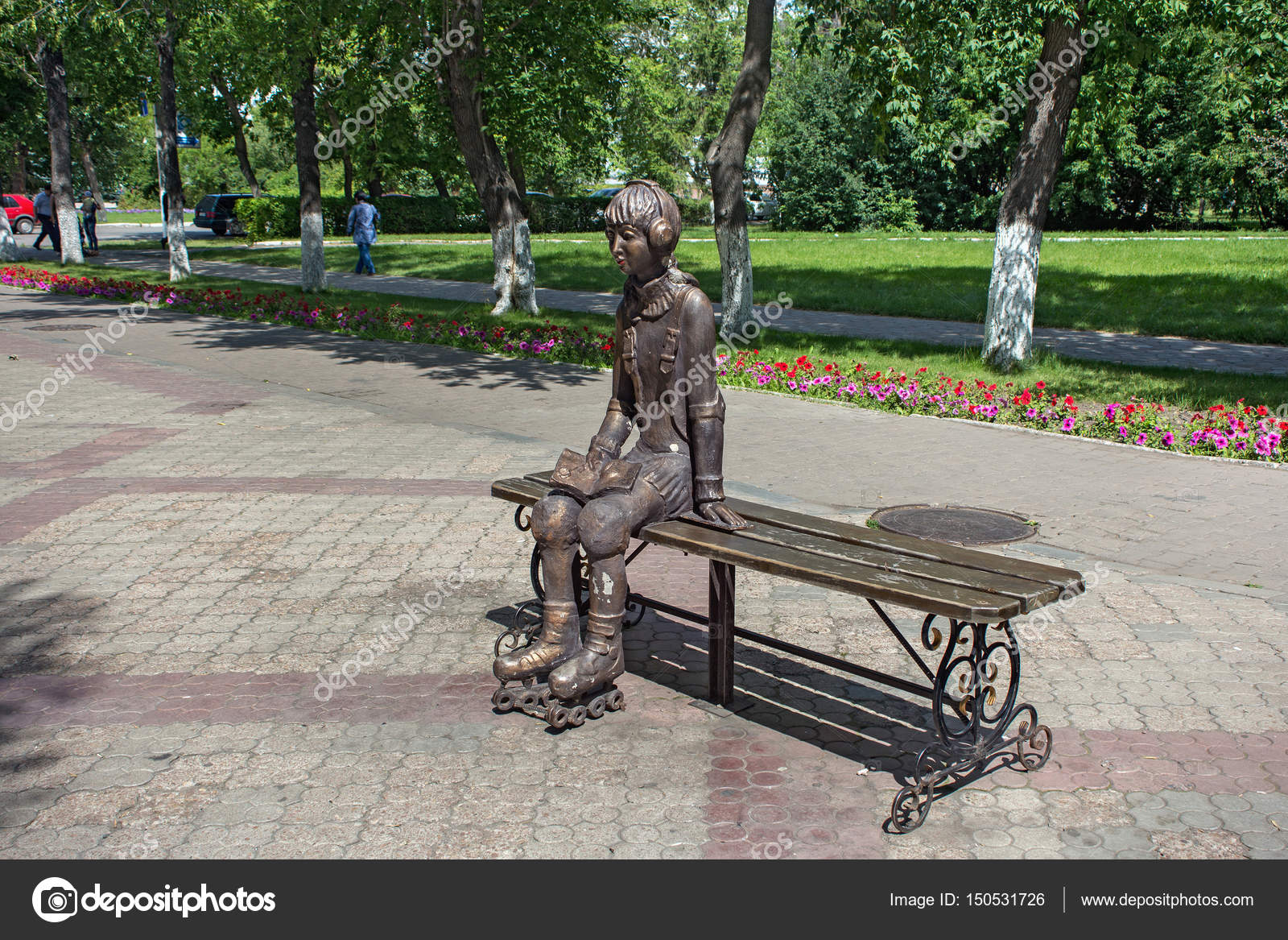 City Sculpture Of A Young Girl On Roller Skates Which Resting On