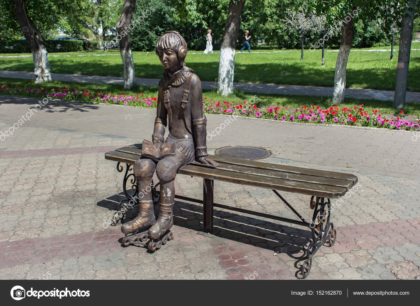 City Sculpture Of A Young Girl On Roller Skates Which Resting On