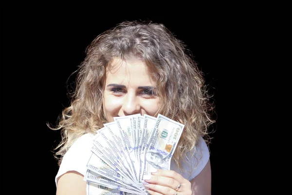 Girl with money on black background — Stock Photo, Image
