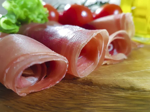 Jamon wooden board cherry tomato, oil — Stock Photo, Image