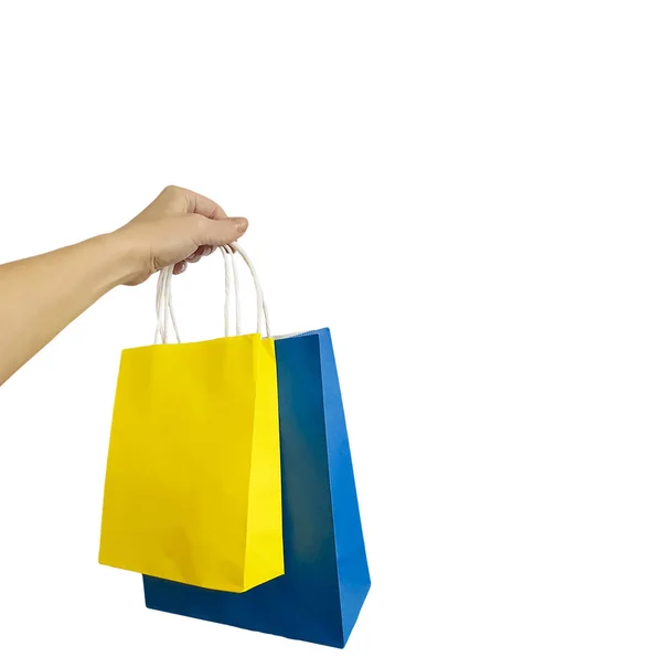 Mão Com Saco Compras Amarelo Azul Isolado — Fotografia de Stock