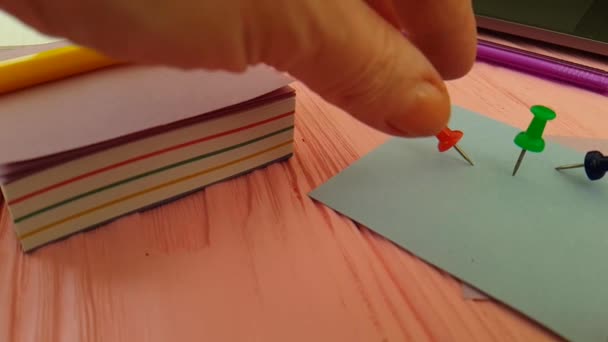 Pushpin Hand Notebook Color Paper — Stock Video