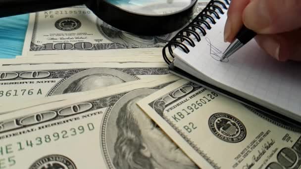 Notebook Dollars Hand Writes Slow Motion Office — Stock Video