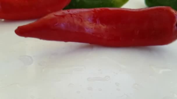Red Pepper Wet White Background Spinning — Stock Video