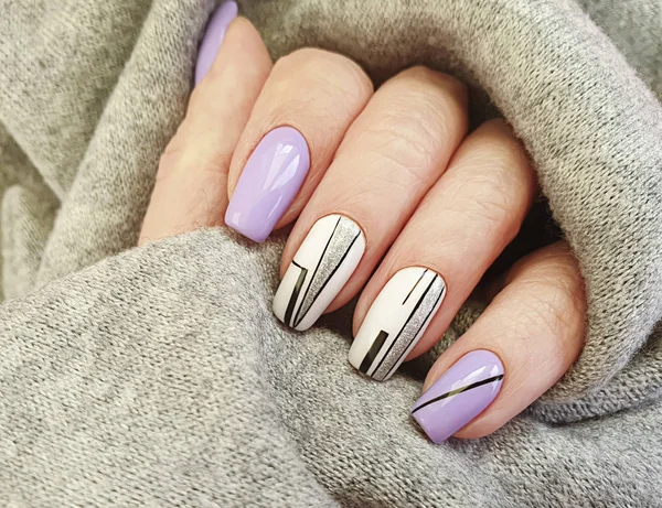 female hand nail beautiful manicure sweater