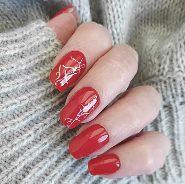 female hand nails manicure red