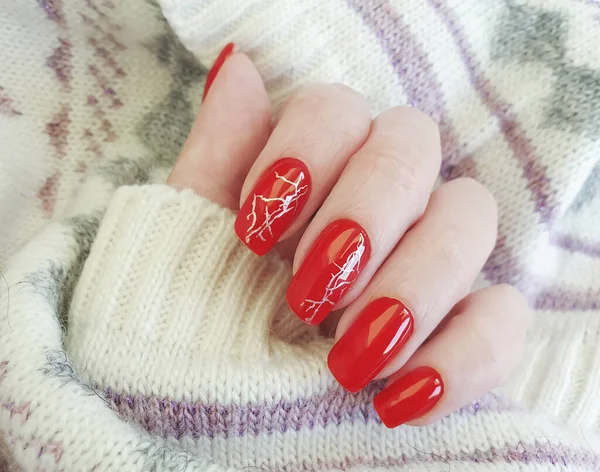 female hand nails manicure red