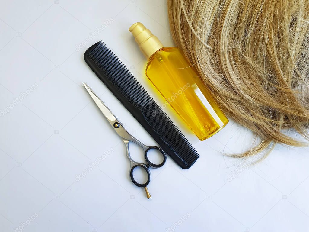 female hair, oil, comb, scissors