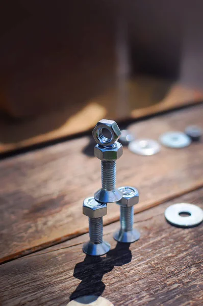 Figure of small robot assembled from bolts and nuts — Stock Photo, Image
