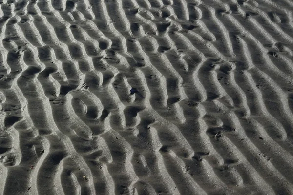 Padrão de areia perto do mar Fotos De Bancos De Imagens