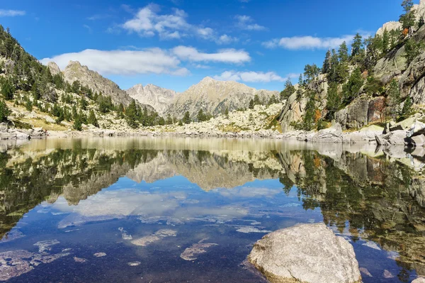  .Reflection of clouds in lake Monastero, Midi-Pyrenees.
