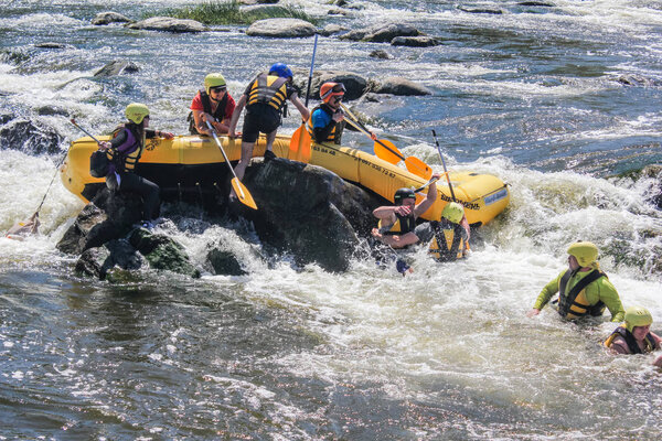 Mygiya,  Ukraine - April 29 2018: Accident in rafting. A group of rafters encounter a rescue operation while rafting down Pivdennyi Buh River