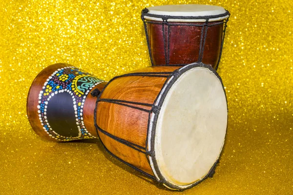Darbuka on a yellow background two pieces. African drum toned Stock Photo