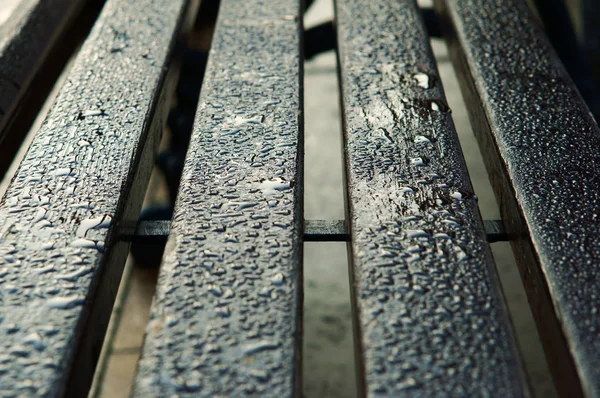 Wet bench, water drops on wooden bars — Stock Photo, Image