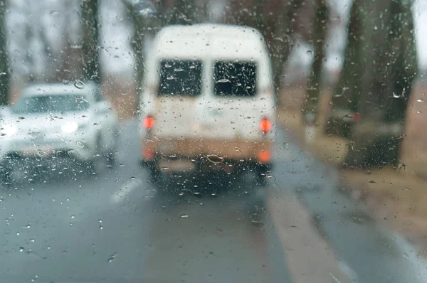 rain on glass, drive on highway in heavy rain, raindrops on car glass, wet asphalt