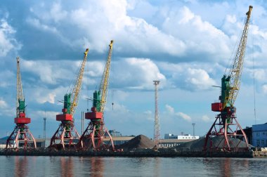 Port cranes. Commercial port of the Baltic Sea. Kaliningrad Sea Fishing Port. clipart