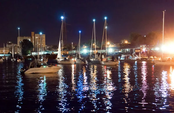 boats pass along the river at night, bridge swing night